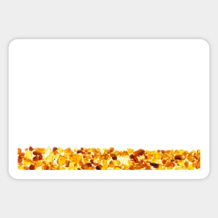 Amber abstract background made of small pieces lying at the bottom Sticker